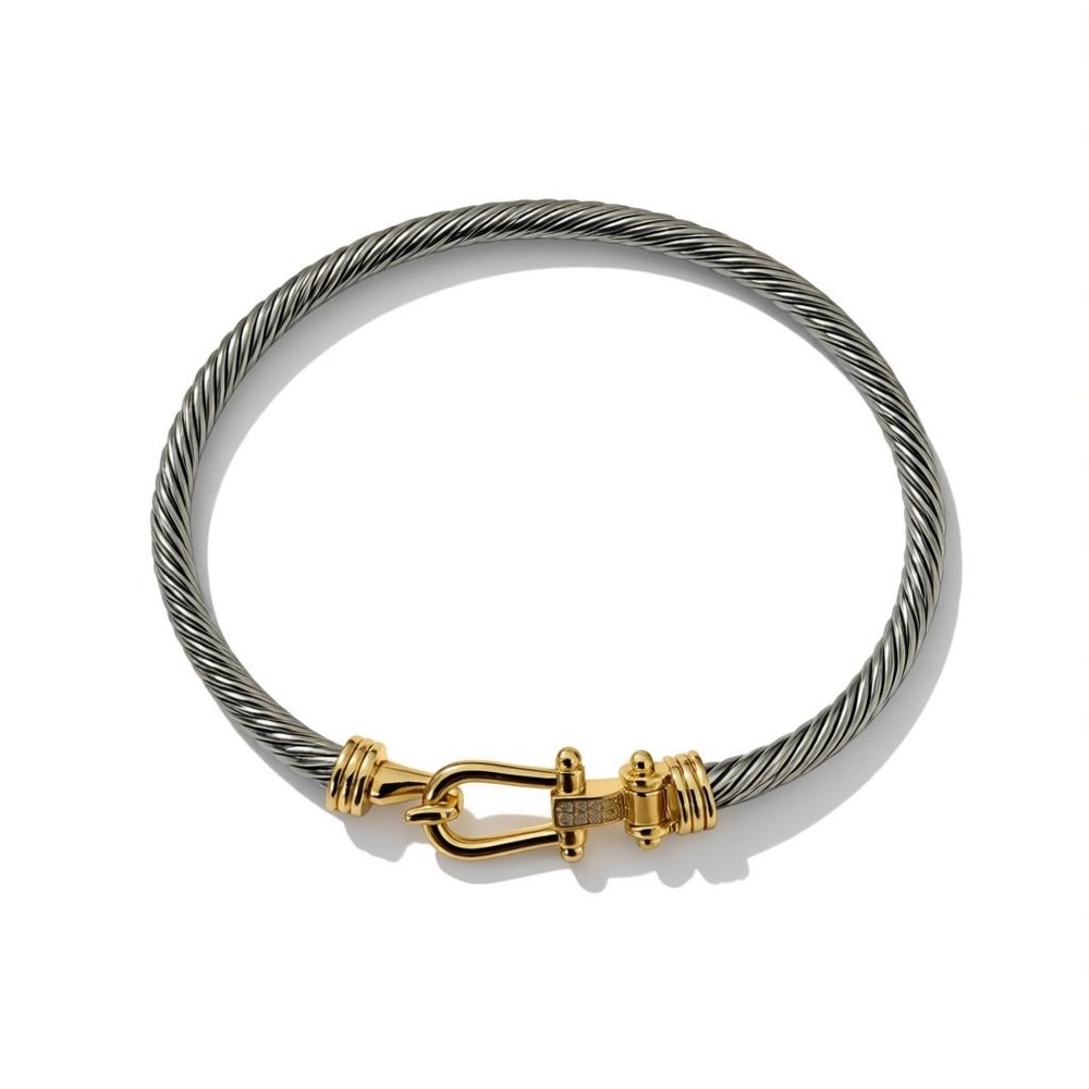 Elegant Buckle Classic Cable Bracelet” in sterling silver with gold.